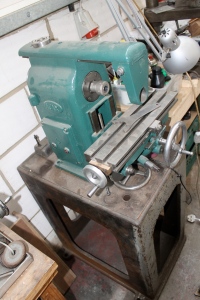 Putting a horizontal mill together on top of a cast flypress stand. 
